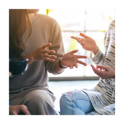 Close up of people talking together.