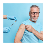 An  man with grey hair and bear rolling his sleeve up in preparation to have a vaccine.