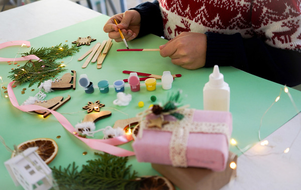 A child is crafting Christmas decorations