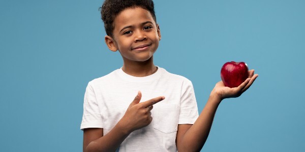 Young person with an apple