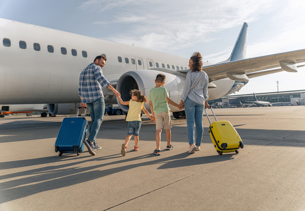 Family boarding a plane