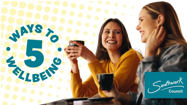 Two women connecting and smiling over a cup of tea