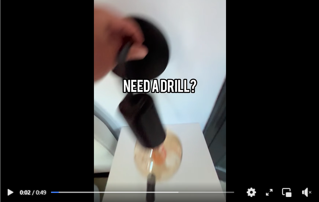 A still image from a video which says 'Need a drill?'