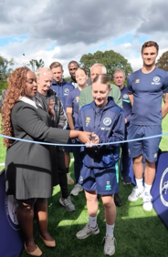 Photo of Cllr Mwangangye opening the new pitch at St Paul's sports ground