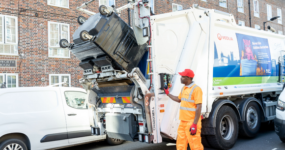 Waste truck and worker in Southwark