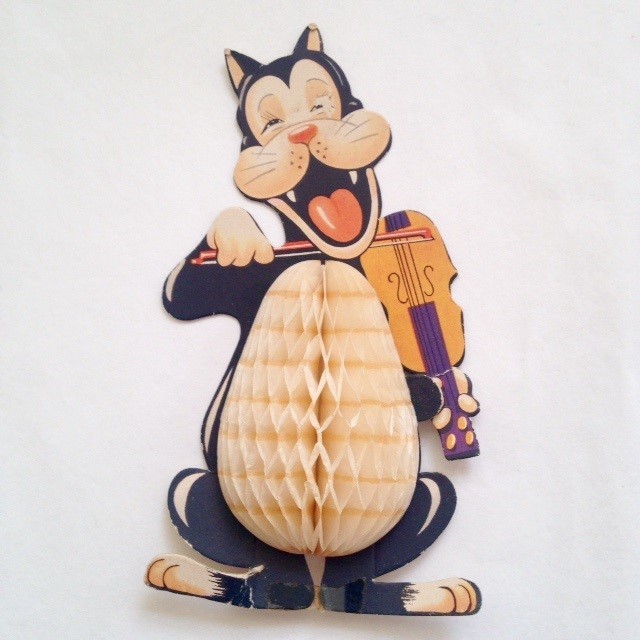 Paper decoration of cartoon cat playing a fiddle