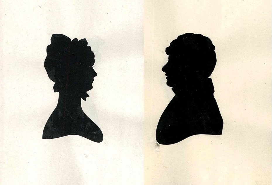 Silhouette portraits of members of the Bagot family - one female and one male facing each other