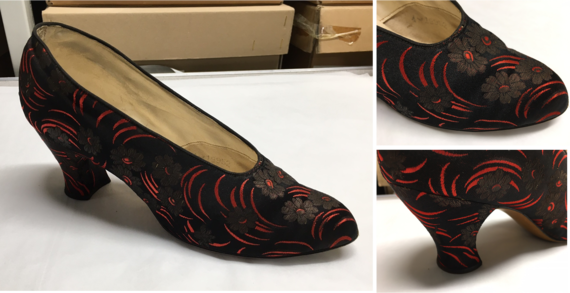 1930s black fabric shoe patterned with bright red sweeping curves and black daisies with scarlet centres