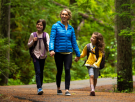 Family walking in woods