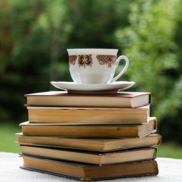 Tea cup on top of a pile of books