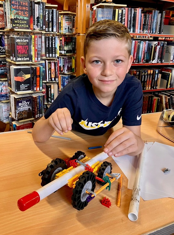 Child making a rocket car
