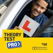 Young man holding Learner plate