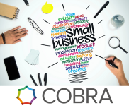 A lightbulb made up of business related words, surrounded by stationary items