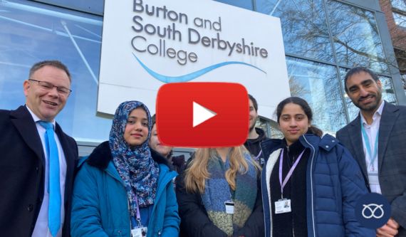 Philip White with students outside South Derbyshire College 