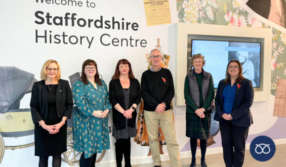 archives team in front of Staffordshire history centre sign