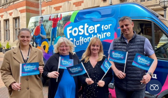 fostering team holding fostering flags 