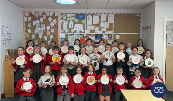 children from Christ Church Primary School holding their plate designs 