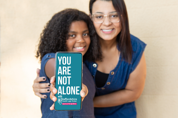 Mum and daughter and phone with app