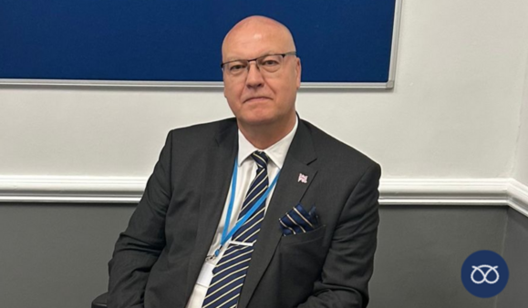 ian cooper smiling at camera