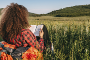 woman sitting in countryside