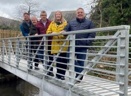 Councillor Helen Campbell, Chair of the District Council’s Public Realm Committee, and members of the project team are pictured on the new bridge