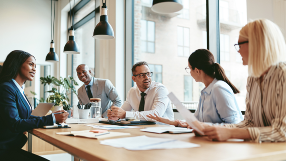 a group of people collaborating on a project in an office