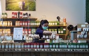 hospitality industry worker at a deli counter wearing a face mask