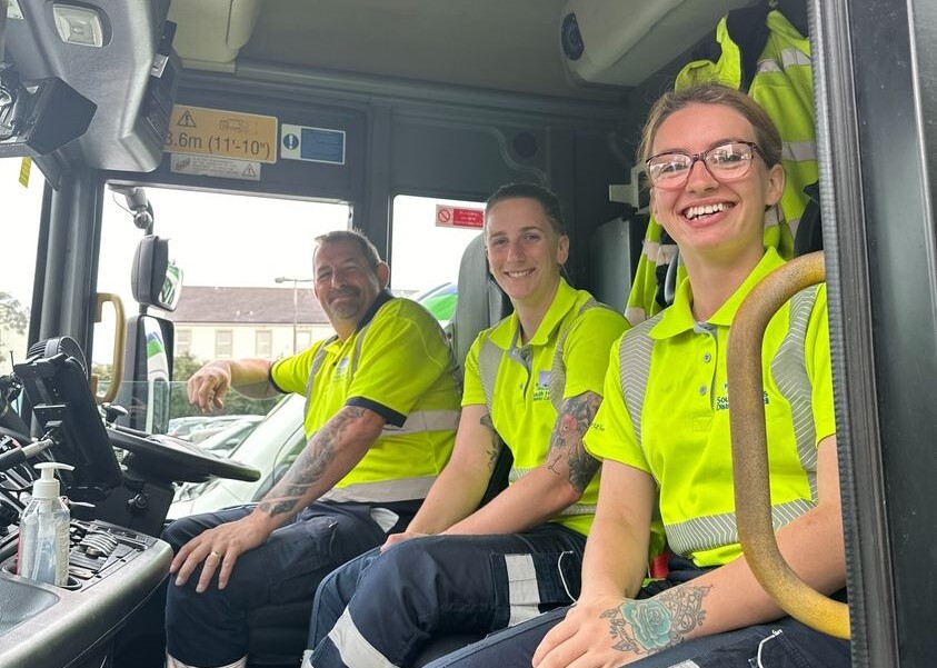 waste collection team in vehicle