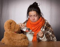 lady with symptoms and teddy bear