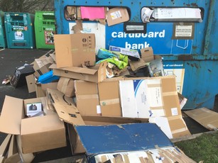 Waste dumped outside recycling containers