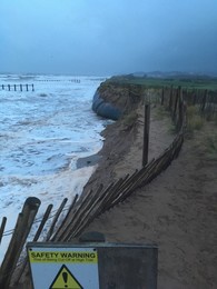 Dawlish Warren dune footpath closure with beach and sea in background