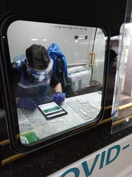 Covid mobile testing van showing individual inside