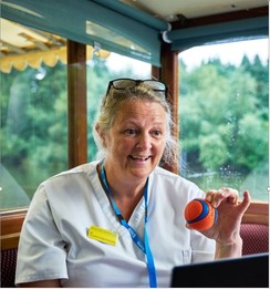 NHS staff member holding a ball in a non NHS setting