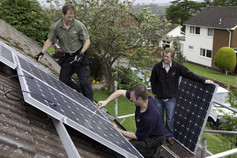Solar panels being fitted on a roof of a home