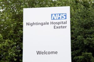 Sign saying NHS Nightingale Hospital, Exeter.  Welcome