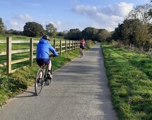 Young people cycling along Stover trail