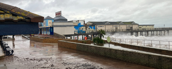 waves over the pier at Teignmouth