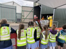 Children from Canada Hill Primary school see the new baler in action