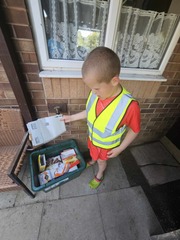 Young boy sorting recycling