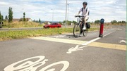 A person cycling on a cylce path
