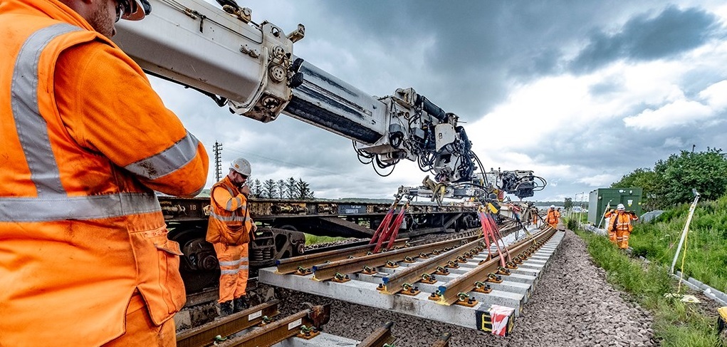 Construction workers improving railway tracks