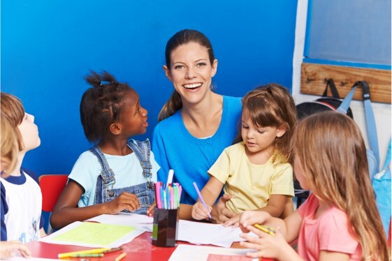 Childminder grant scheme pic adult with three children drawing