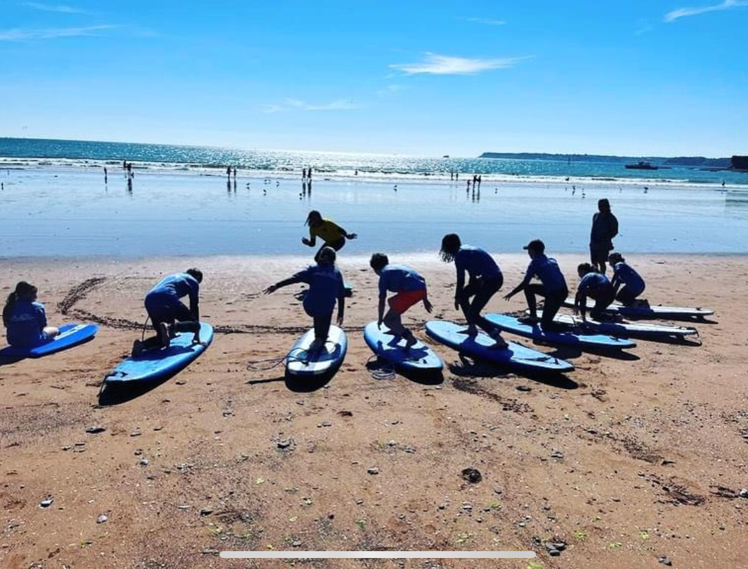 Kids surfing on beach