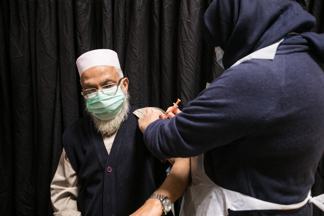 Elderly man receiving Covid-19 vaccine