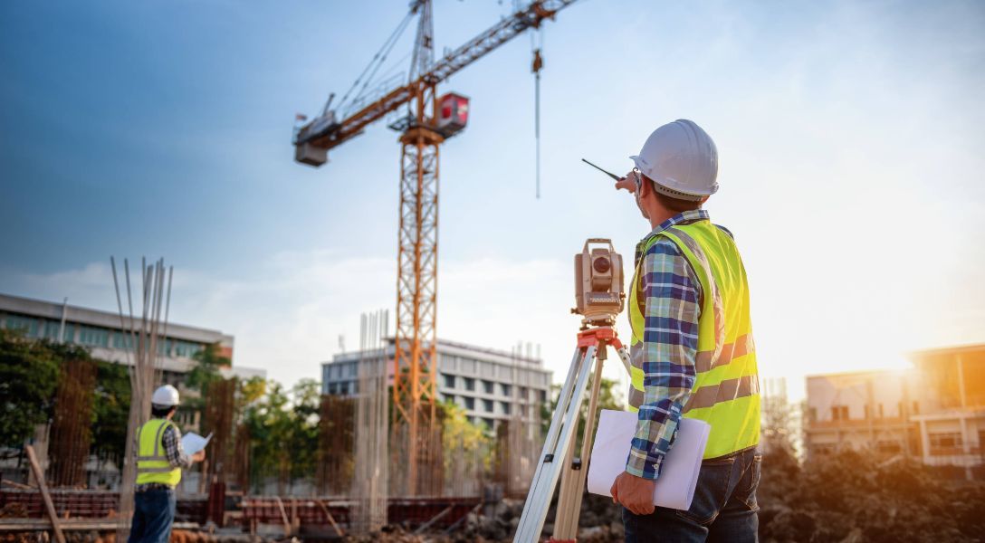 man coordinating materials on a construction site