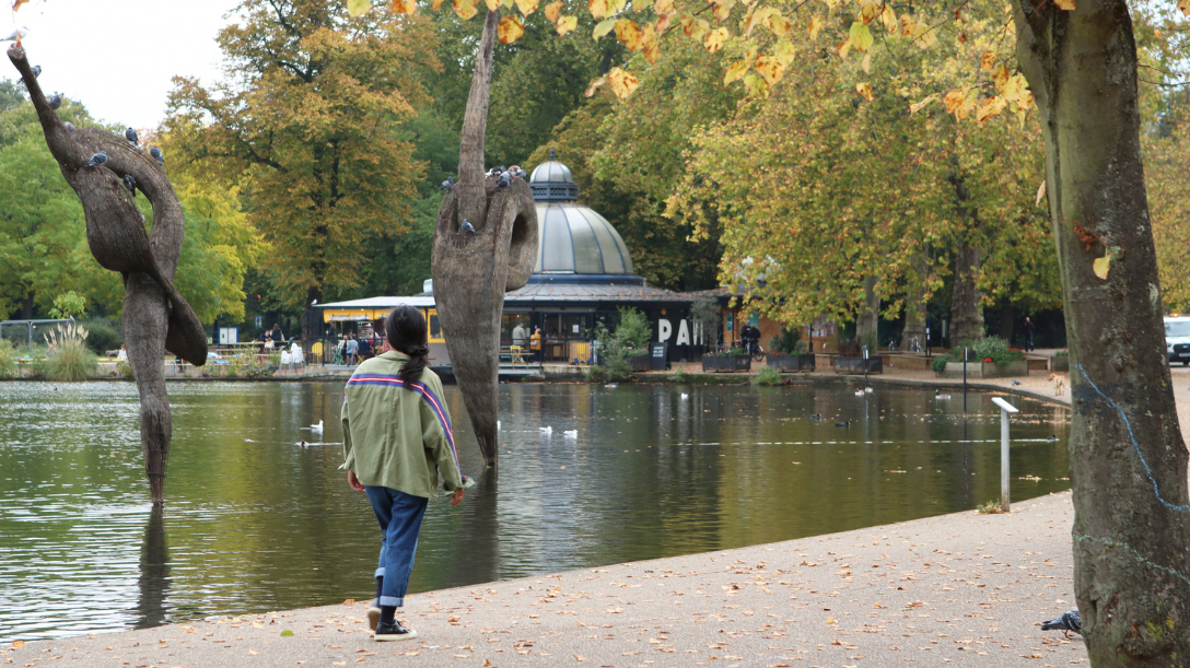 Person walking along the lake in Victoria Park