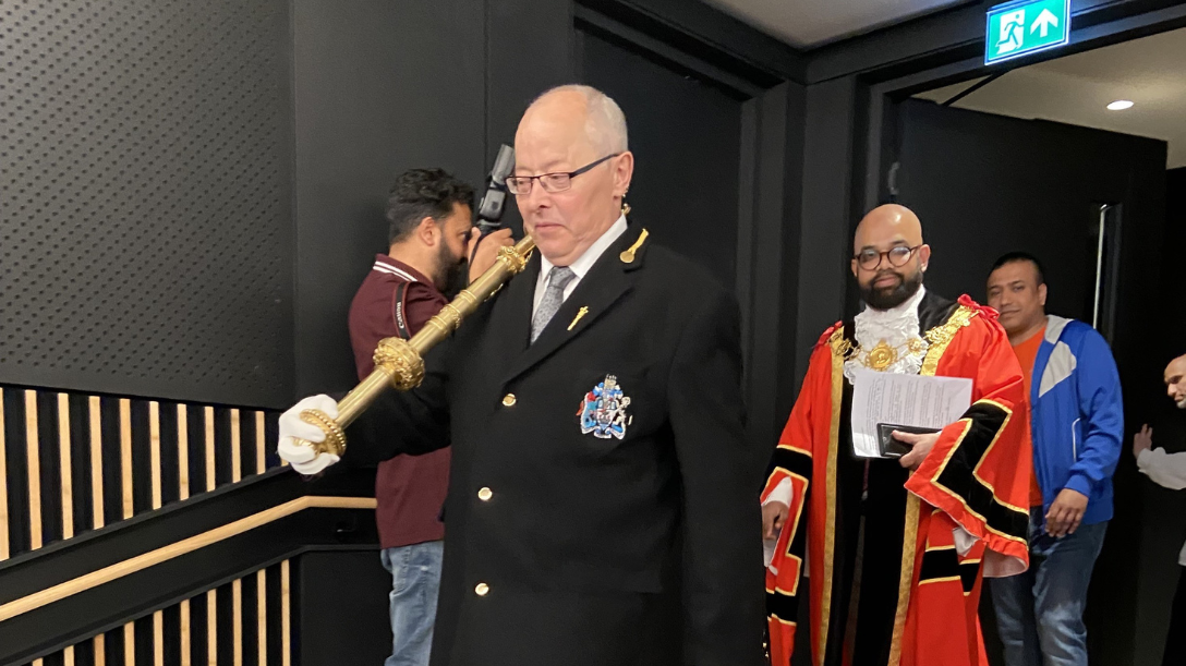 New speaker of the council walking in the council chambers