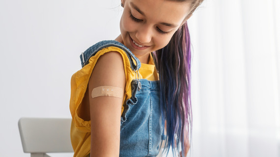 Girl after having vaccination in arm