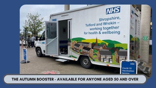 A photo of Betty the vaccination bus, with the words 'Autumn Booster available for anyone over 50yrs' underneath