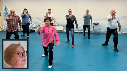 A Tai Chi class led by a woman with 6 students mirroring her movements. Inset is a small photo of Carolyn from Hadley